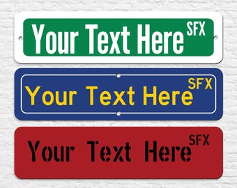 May include: Three rectangular street signs with white borders and rounded corners. The top sign is green with white text that says "Your Text Here SFX". The middle sign is blue with yellow text that says "Your Text Here SFX". The bottom sign is red with black text that says "Your Text Here SFX".