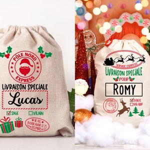 May include: Two white canvas Santa sacks with red and green designs. The sacks are personalized with the names "Lucas" and "Romy". The text on the sacks reads "P&ocirc;le Nord Express Livraison Sp&eacute;ciale" and "Service Express Livraison Sp&eacute;ciale".