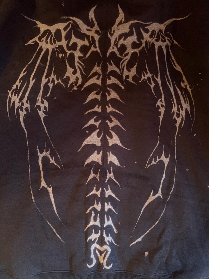 Skeletal wings and spinal cord bleach painted sweatshirt / Etsy