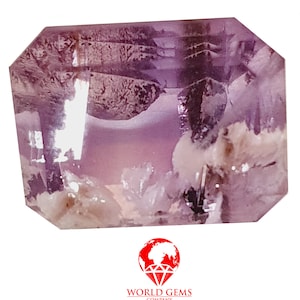 May include: A purple and white gemstone with a faceted cut. The gemstone has a cloudy appearance with a hint of pink.