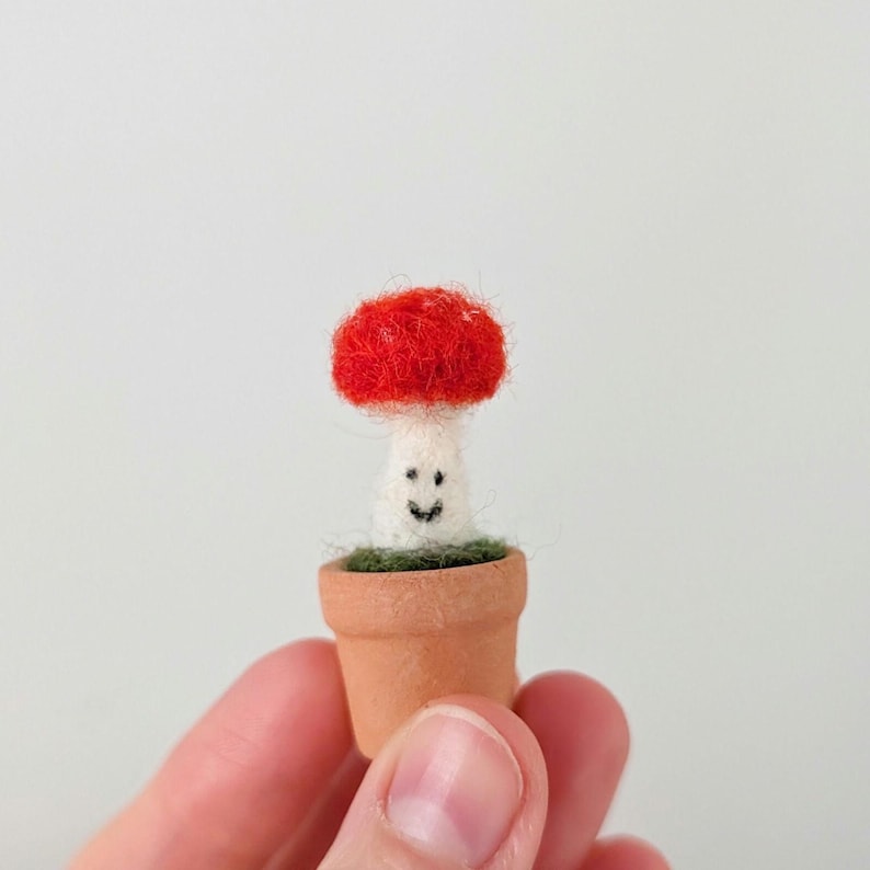mini felt mushroom on a mini plant pot