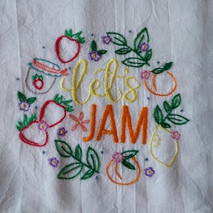 Embroidered Flour Sack/Kitchen Towel featuring fruit  and the words Lets Jam,