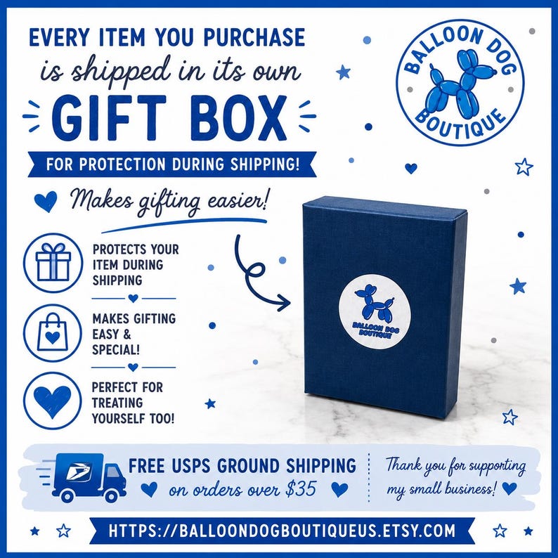 May include: A dark blue rectangular gift box featuring a white circular sticker with a blue balloon dog graphic and the text BALLOON DOG BOUTIQUE. The surrounding text includes EVERY ITEM YOU PURCHASE is shipped in its own GIFT BOX.