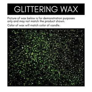 May include: Close-up of green glitter embedded in black wax. The glitter is a mix of light and dark green, creating a sparkling effect.
