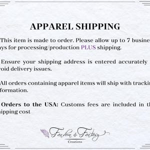 May include: A white background with the text "APPAREL SHIPPING" in black. Bullet points provide information on order processing, shipping address accuracy, tracking, and customs fees for USA orders. The Fandom & Fantasy Creations logo is at the bottom.