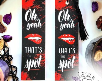 May include: Two black and red bookmarks with a red lip design and the text "Oh, yeah that's the spot".