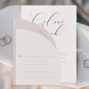 May include: A wedding RSVP card with a pink and white design. The card has a handwritten name at the top, "Celine Rob", and the word "DETAIL" in all caps. The card has two options for the guest to choose from: "Delightfully Accepts" or "Regretfully Declines". The card also includes the wedding details: "5 PM at Marriage York".