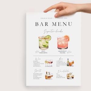 May include: A bar menu with a watercolor illustration of a spicy margarita and a grapefruit paloma. The menu lists wine, spirits, beer, and non-alcoholic options.
