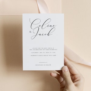 May include: A white wedding invitation card with black text. The card features the names "Geline & Jacob" in elegant cursive script. The invitation details the wedding date, time, and location: "Saturday, May 23, 2024 at 5 PM, Marriott Essex House New York". The text "Reception to follow" is also included.