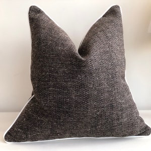 Textured Dark Grey/black cushion cover with white trim. Cushions with piped edge. Luxury home decor