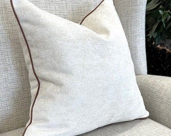 Textured ivory cushion cover with brown piped edge |  neutral decor