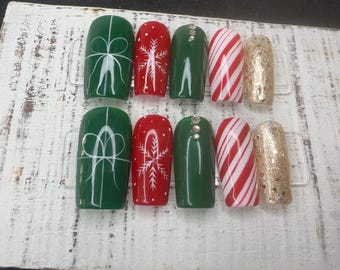 Holiday Magic Gift Press-On Nail Set | Green, Classic Christmas Red and Candy Cane Stripes | Snowflakes, Bow Accent Nail & Gold Glitter