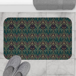 May include: A teal and gold patterned bath mat with a damask design. The mat is made of a soft, absorbent material and is perfect for adding a touch of elegance to any bathroom.