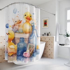 May include: A watercolor illustration of three yellow rubber duckies in a blue bucket with a blue bottle and a bar of soap. The duckies are surrounded by colorful water droplets.