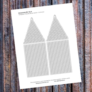 May include: A printable template for creating beaded earrings using the double brick stitch. The template shows two identical earring designs, each with a pointed top and a rectangular body. The template is labeled "Designs by Suz" and includes the text "Template | Double Brick Stitch - 15 Across".