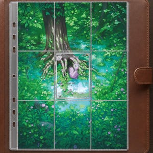 May include: A brown leather binder containing a clear plastic trading card sleeve with a nine-pocket grid. A single Goomy trading card is inserted in the center pocket, featuring a purple creature in a lush green forest with a pond and tree.