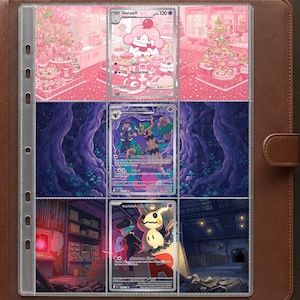 May include: A brown leather binder containing a clear plastic sheet with three trading cards. The top card features a pink Slurpuff, the middle card shows a Trevenant in a dark forest, and the bottom card displays a Mimikyu in a dark room.