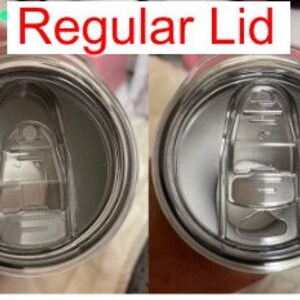 May include: Close-up of a stainless steel tumbler lid with a small hole for sipping. The lid is silver and has a smooth, shiny finish.