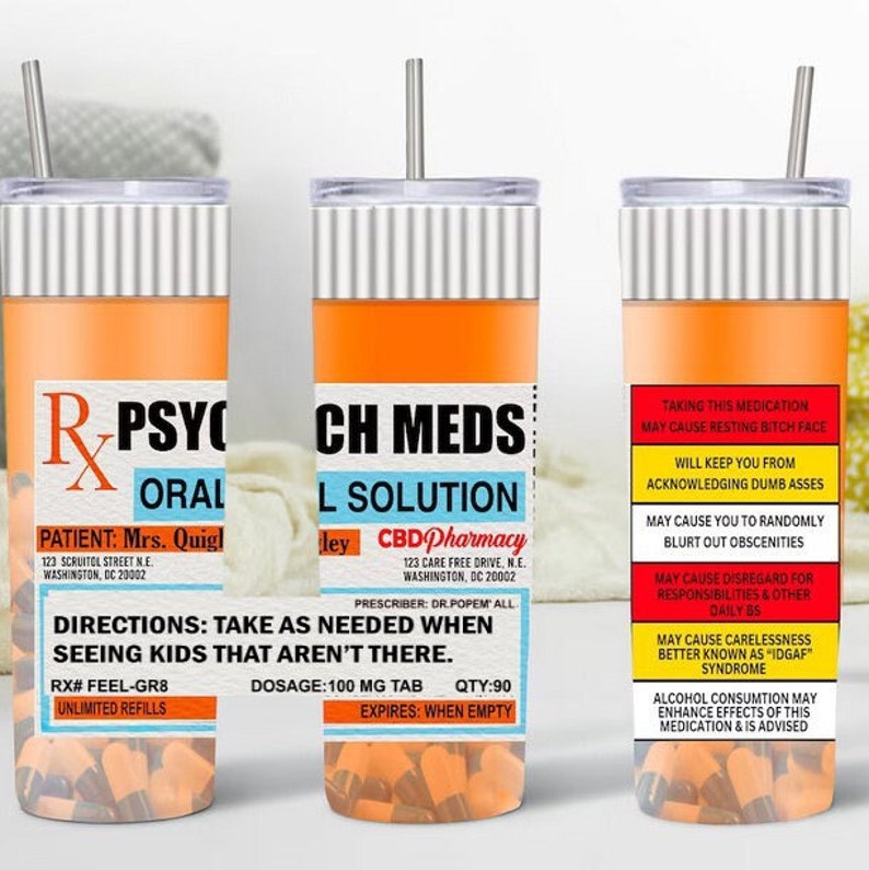 May include: Two orange and white insulated tumblers with a pill bottle design. The text on the tumblers reads "R-PSYCHO ORAL" and "CH MEDS L SOLUTION". The tumblers are filled with orange and white pills.