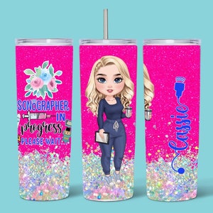 May include: A pink glitter tumbler with a cartoon image of a woman wearing scrubs and holding a clipboard. The text on the tumbler reads "Sonographer in progress please wait..." and "Cassie".
