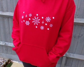 red sweatshirt with snowflakes