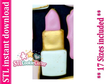 May include: A lipstick-shaped cookie cutter with a light pink top, a metallic gold middle section, and a white base with gold speckles. The text on the side reads STL instant download and ** 17 Sizes included **.