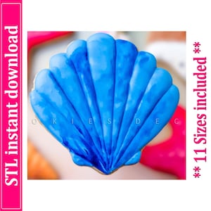 May include: A seashell-shaped cookie with bright blue frosting. The cookie has a detailed, textured design and is surrounded by other colorful treats. Text on the image reads "STL instant download" and "** 11 Sizes included **".