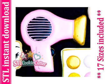 May include: A pink hair dryer cookie cutter with a gold nozzle and a black handle button. The image includes the text STL instant download and 17 Sizes included. The design features a circular air intake vent with horizontal slats on the side.