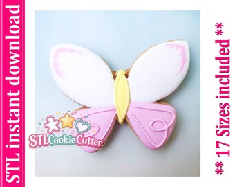 May include: A butterfly-shaped cookie with white upper wings featuring pink edges, a yellow central body, and light pink lower wings with a swirl design. The text STL instant download and 17 Sizes included are visible on the sides.