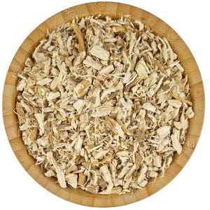 May include: A wooden bowl filled with dried, light brown, and beige root pieces. The root pieces are chopped into small, irregular shapes.