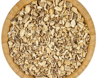 May include: A wooden bowl filled with dried, light brown, and beige pieces of angelica root.