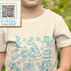 May include: A white t-shirt with a blue design of winter-themed illustrations, including a snowman, a house, a gingerbread person, and a pair of ice skates. The text "IF I'M LOST SCAN HERE!" is printed on a framed QR code in the top left corner of the image.