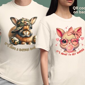 May include: Two white t-shirts with different Easter bunny designs. The first shirt features a brown bunny wearing a camouflage hat and holding Easter eggs. The text on the shirt reads "It's been a hopping good". The second shirt features a pink bunny wearing heart-shaped sunglasses and a pink bow. The text on the shirt reads "It's about to get hoppier".