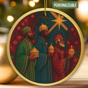 May include: Round Christmas ornament featuring three figures in colorful robes, each holding a golden vessel. The ornament has a gold border and a gold string for hanging. The background is a mix of red, green, and blue with a star and the text "PERSONALIZABLE".