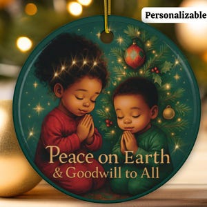 May include: Round Christmas ornament featuring two children in prayer, set against a Christmas tree backdrop. The ornament has the text "Peace on Earth & Goodwill to All". The ornament is green with a gold hanging string and the word "Personalizable" in white.