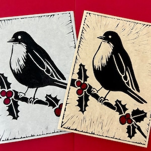 Linocut printed Christmas cards, rustic and vintage looking, featuring a happy robin!
