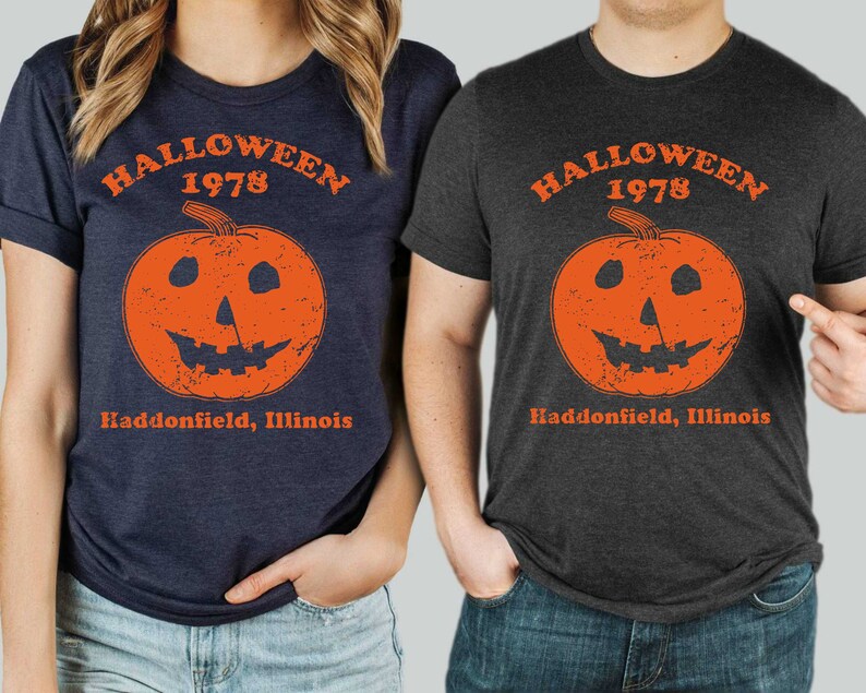 May include: Two t-shirts with a distressed orange pumpkin graphic and the text "Halloween 1978 Haddonfield, Illinois".