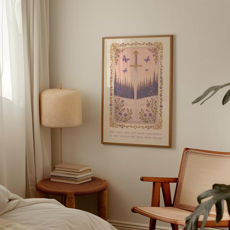 May include: Framed art print featuring a sword design with a forest scene in shades of purple and green. The print includes butterflies and floral accents, with text at the bottom. The frame is a light brown color.
