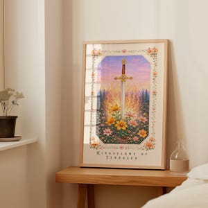 May include: Framed art print featuring a sword with a gold hilt, set against a fiery background and floral foreground. The artwork is enclosed in a light wood frame and includes the text "Kingsflame of Terrasen".