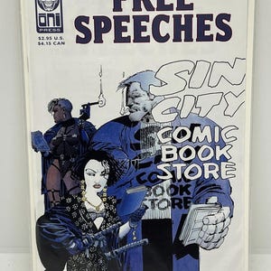 May include: A comic book cover with the title "FREE SPEECHES" in dark blue. The cover features illustrations of characters and the text "SIN CITY COMIC BOOK STORE". The Oni Press logo and price are visible.
