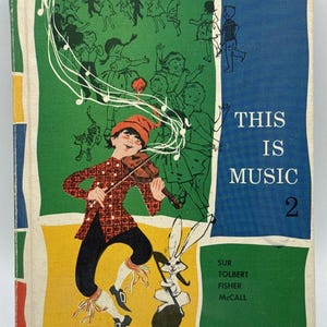 May include: Vintage book cover titled "This Is Music 2" with a colorful illustration. A boy in a red hat plays a violin, surrounded by musical notes and dancing figures. The cover has green, blue, and yellow sections.