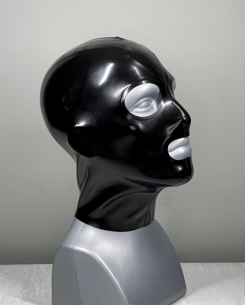 May include: A black latex balaclava with a shiny finish. The balaclava has eye and mouth openings.