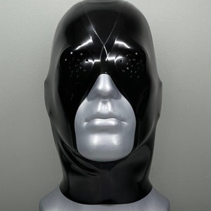 May include: A black latex mask with a visor and eye holes. The mask is on a gray mannequin head.