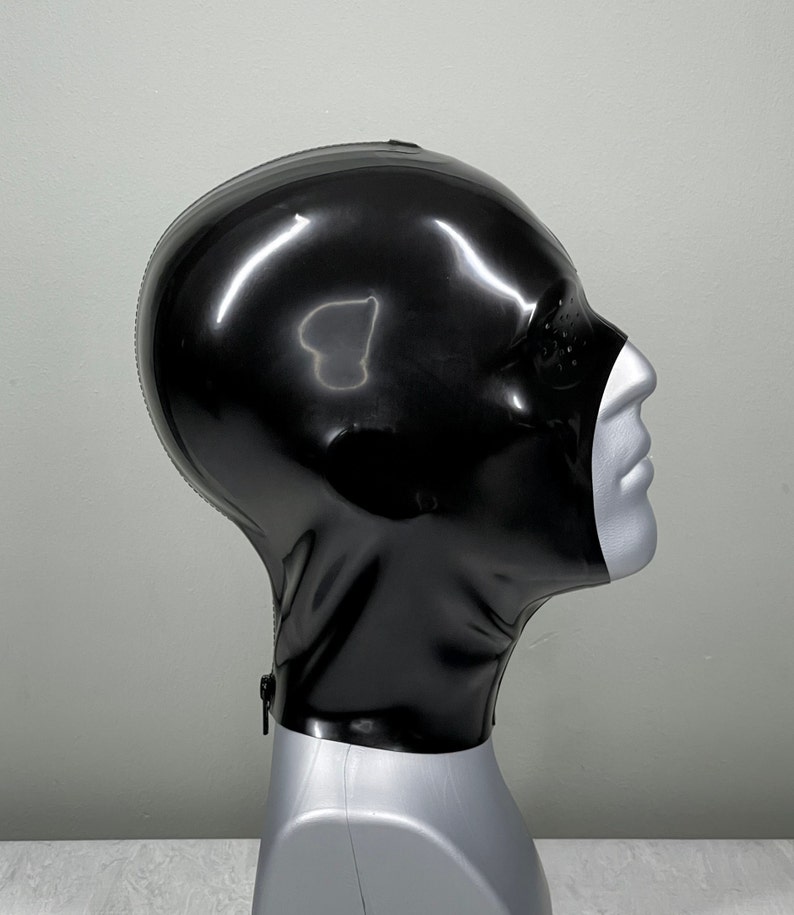 May include: A black latex hood with a zipper at the neck. The hood is on a mannequin head.