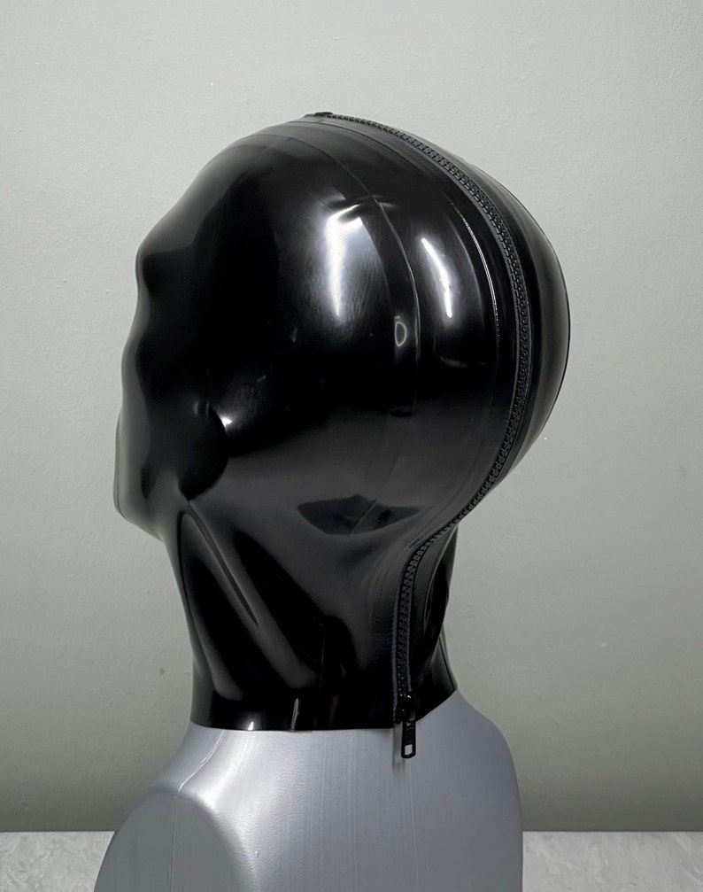 May include: A black latex hood with a zipper down the back.