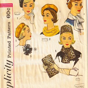 May include: Vintage Simplicity pattern featuring illustrations of women's hats and accessories. The designs include berets, a pillbox hat, scarves, and a leopard print clutch. The pattern is marked "One Size" and "Printed Pattern 60c".
