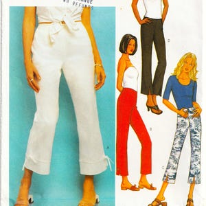 May include: A Butterick sewing pattern featuring various women's pants and tops. The pattern includes a white tie-front top and cropped pants, red pants, black pants, and printed pants. The pattern number is 3394.