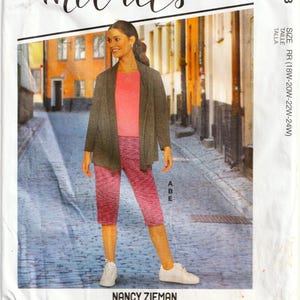 May include: McCall's sewing pattern M8163 showing a woman in a pink top, grey jacket, and pink capri trousers. The pattern includes sizes RR (18W-20W-22W-24W). The text "NANCY ZIEMAN" is visible.