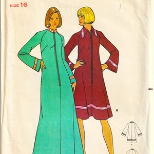 May include: Vintage Butterick sewing pattern showing two women in dresses. One wears a long, teal dress with a zip and decorative trim. The other wears a shorter, burgundy dress with pink trim. The pattern is size 16.