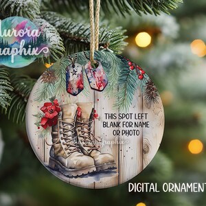 May include: A round, wooden Christmas ornament with a watercolor design of military boots, pine branches, red berries, and dog tags. The ornament has the text "This spot left blank for name or photo".